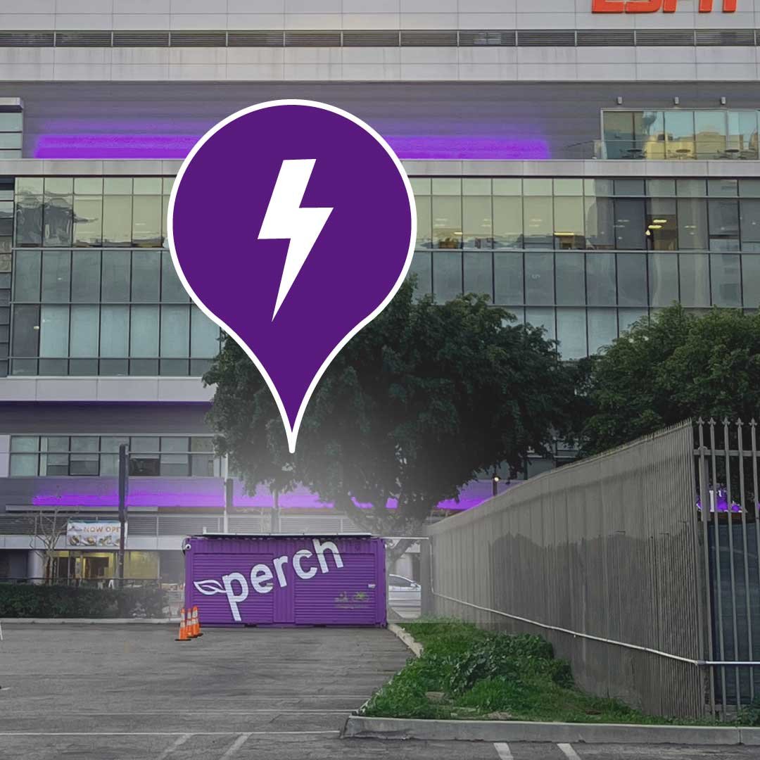 A Perch charging portal in an urban parking lot with a purple location pin icon overlay